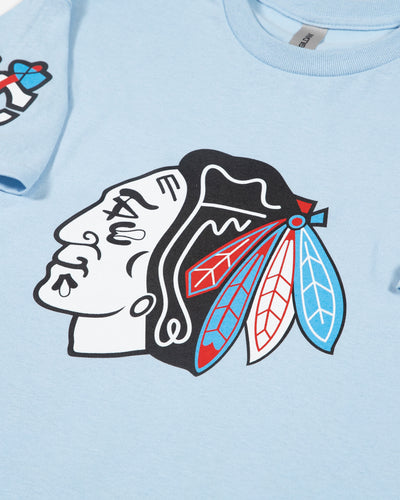 light blue tee with tonal Chicago Blackhawks primary logo across chest, tonal secondary logo on right shoulder and star graphic on left shoulder - primary logo detail image