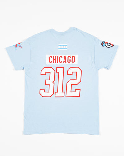 light blue Chicago Blackhawks tee with Chicago 312 in jersey format and Chicago flag on top, tonal secondary logo on right shoulder and star graphic on left shoulder - back lay flat