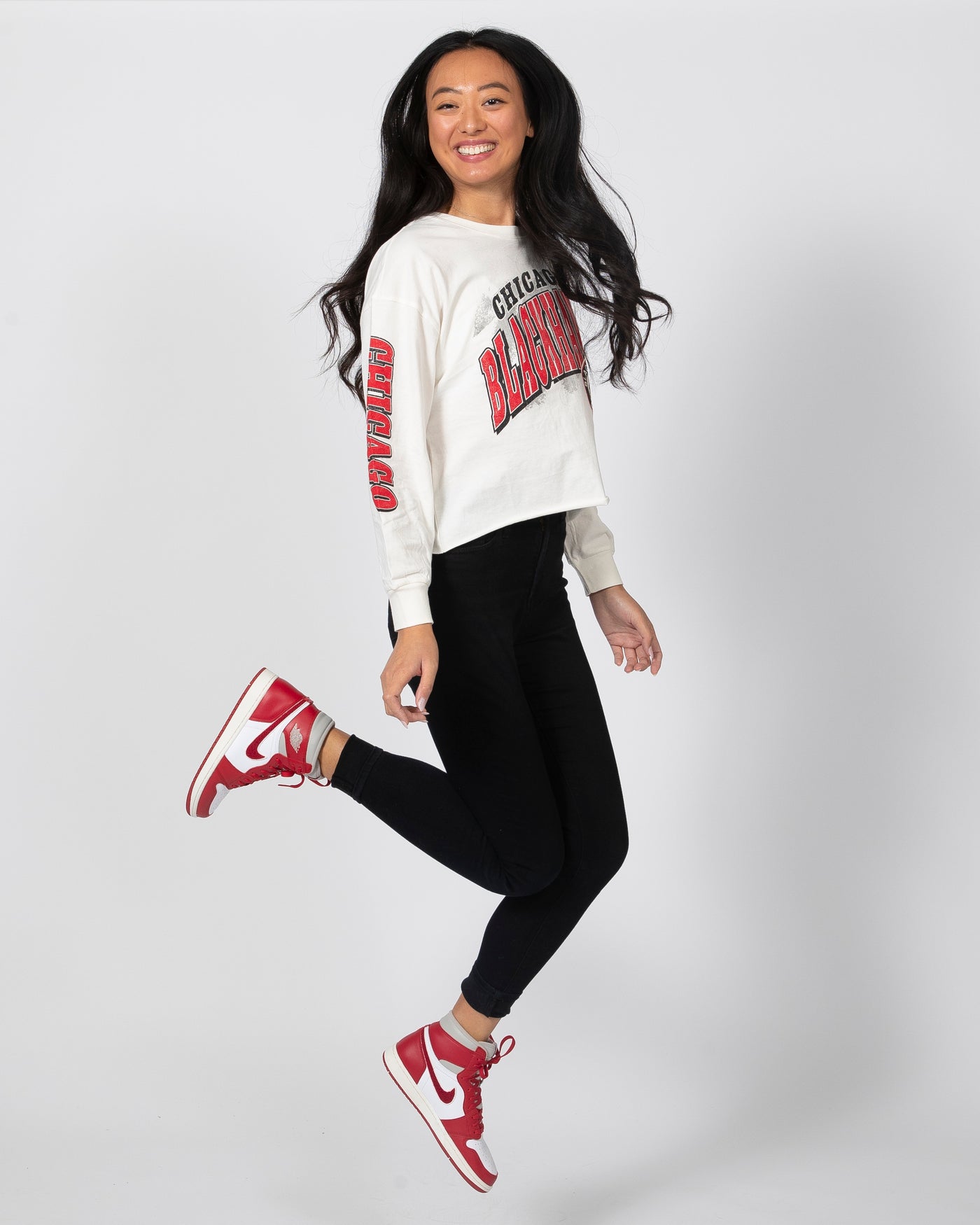 '47 White vintage wash long sleeve with Chicago Blackhawks name on front and primary logo - model jumping