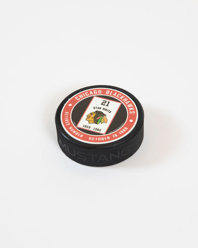 Mustang Stan Mikita retirement banner series red and black background puck - lay flat