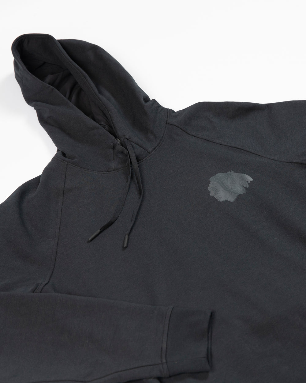 Black lululemon Chicago Blackhawks hoodie with tonal primary logo on left chest - detail lay flat