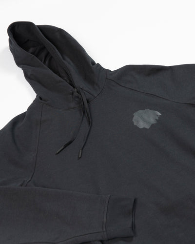 Black lululemon Chicago Blackhawks hoodie with tonal primary logo on left chest - detail lay flat