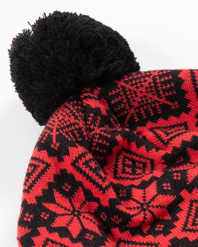 CCM Chicago Blackhawks knit hat with holiday pattern in red and black with black pom and primary logo embroidered on the front black cuff - detail view