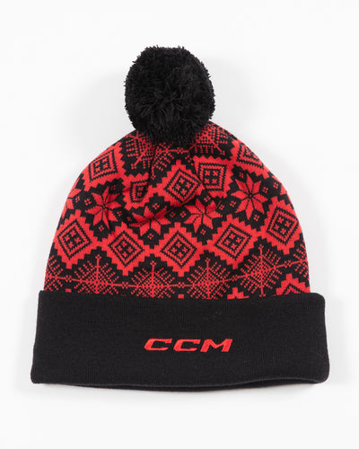 CCM Chicago Blackhawks knit hat with holiday pattern in red and black with black pom and primary logo embroidered on the front black cuff - back view