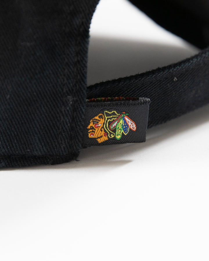 black Chicago Blackhawks adjustable cap with four feathers logo - detail angle