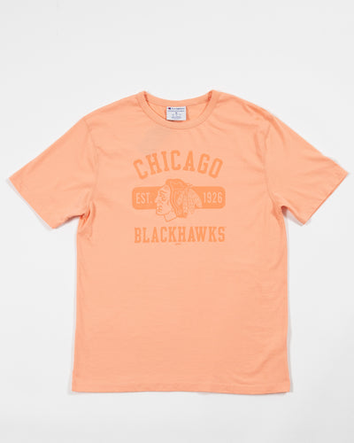 Champion Chicago Blackhawks peach tee with primary logo in center and wordmark across chest - front view