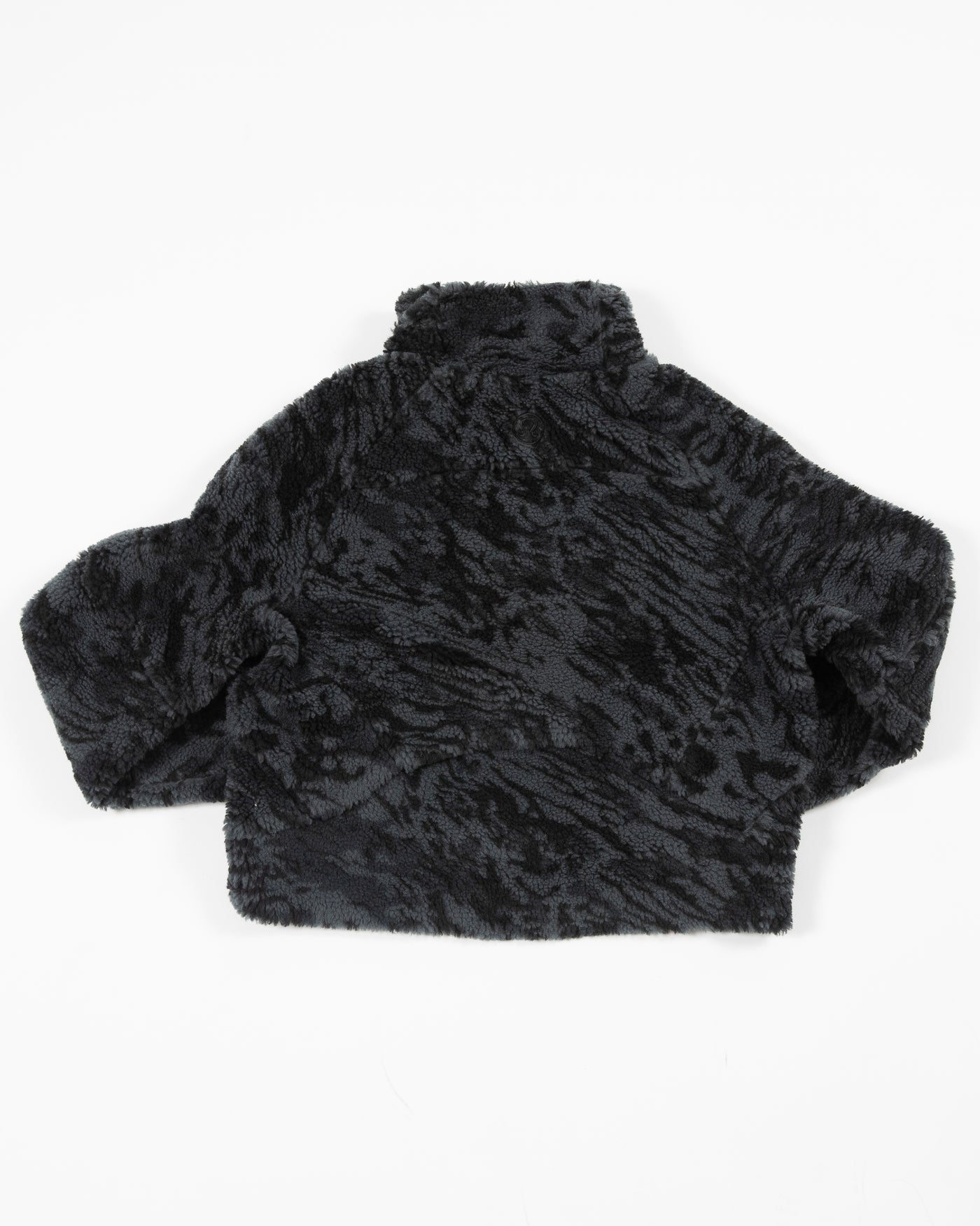black camo fuzzy lululemon half zip jacket with black tonal Chicago Blackhawks primary logo on left shoulder - back lay flat 