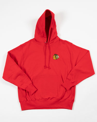 red Champion hoodie with Chicago Blackhawks primary logo embroidered on left chest - front lay flat