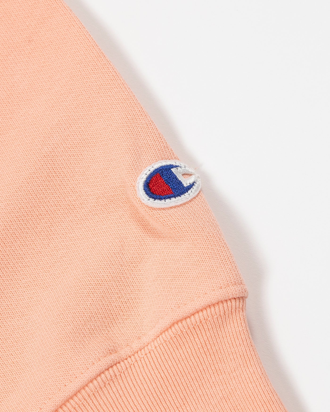 Champion Chicago Blackhawks peach tonal hoodie with embroidered primary logo and Chicago Blackhawks wordmark on left chest - alt detail view 