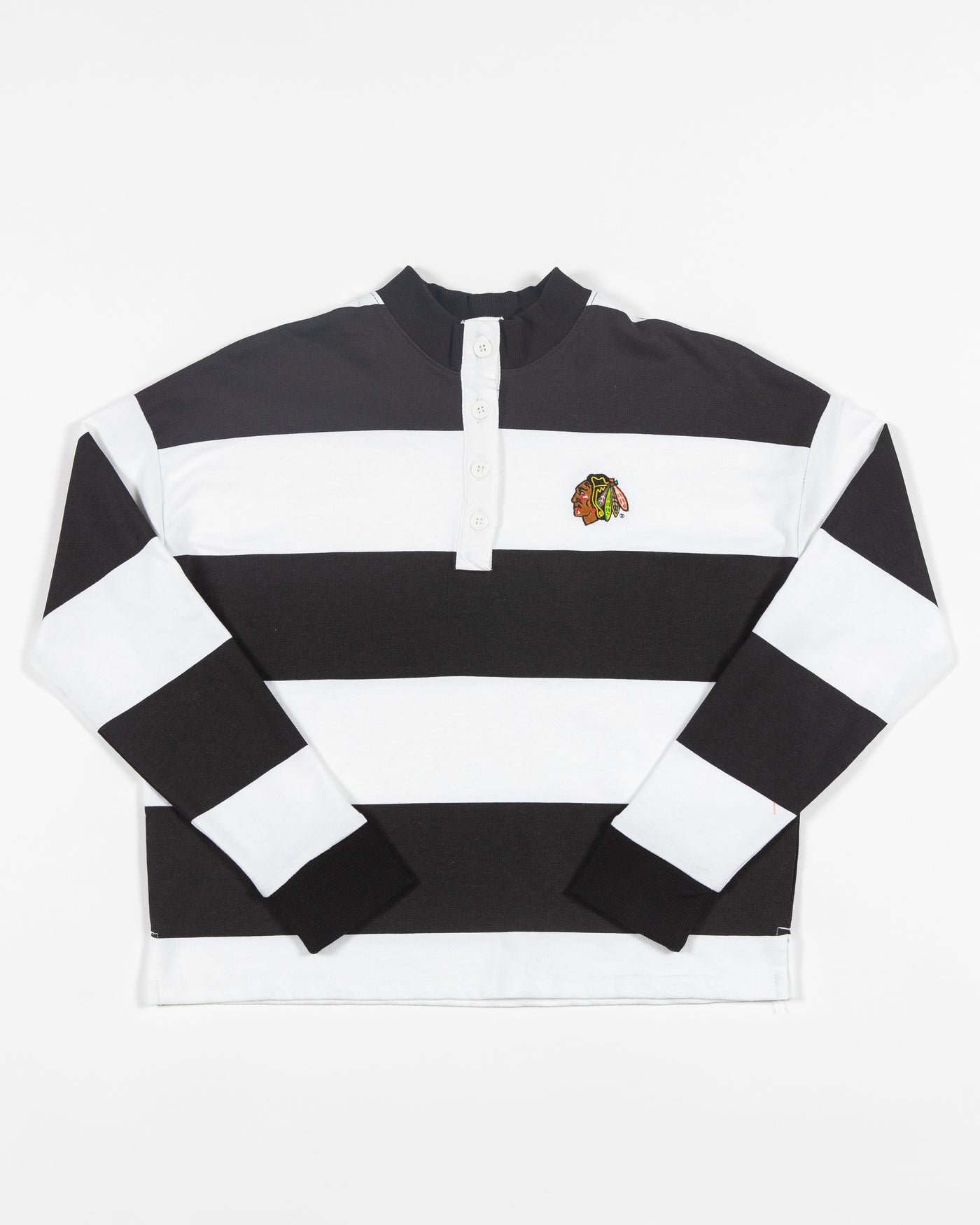 black and white striped rugby shirt with embroidered Chicago Blackhawks primary logo on left chest - front lay flat