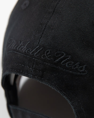 black adjustable cap with white and green Chicago Blackhawks secondary logo - detail lay flat