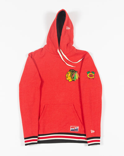 red New Era hoodie with Chicago Blackhawks embroidered primary logo patch on left chest and secondary logo patch on left shoulder - front lay flat