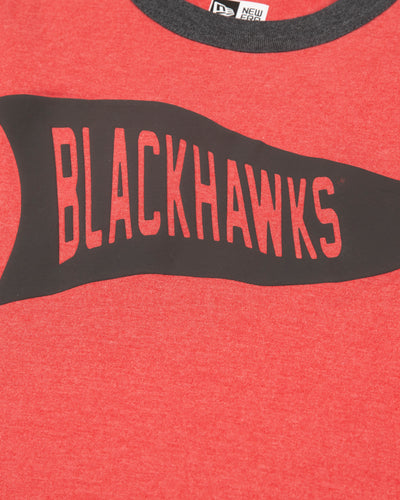 red New Era tee with contrasting neckline and sleeves with Chicago Blackhawks pennant graphic on front - detail lay flat