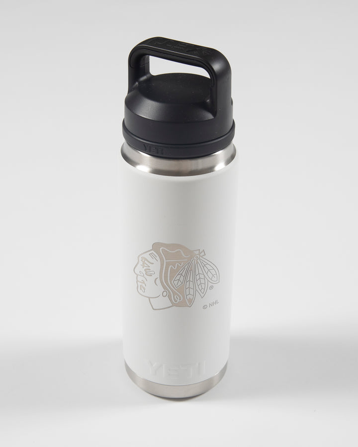 white YETI 26 oz rambler with tonal Chicago Blackhawks primary logo on front - front lay flat