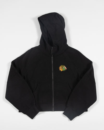 black oversized cropped lululemon hoodie with Chicago Blackhawks primary logo embroidered on left chest - front lay flat