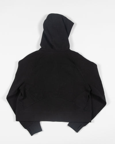 black oversized cropped lululemon hoodie with Chicago Blackhawks primary logo embroidered on left chest - back lay flat