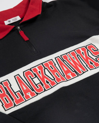 black '47 brand quarter zip with Chicago Blackhawks wordmark graphic across chest and primary logo on left sleeve - detail lay flat