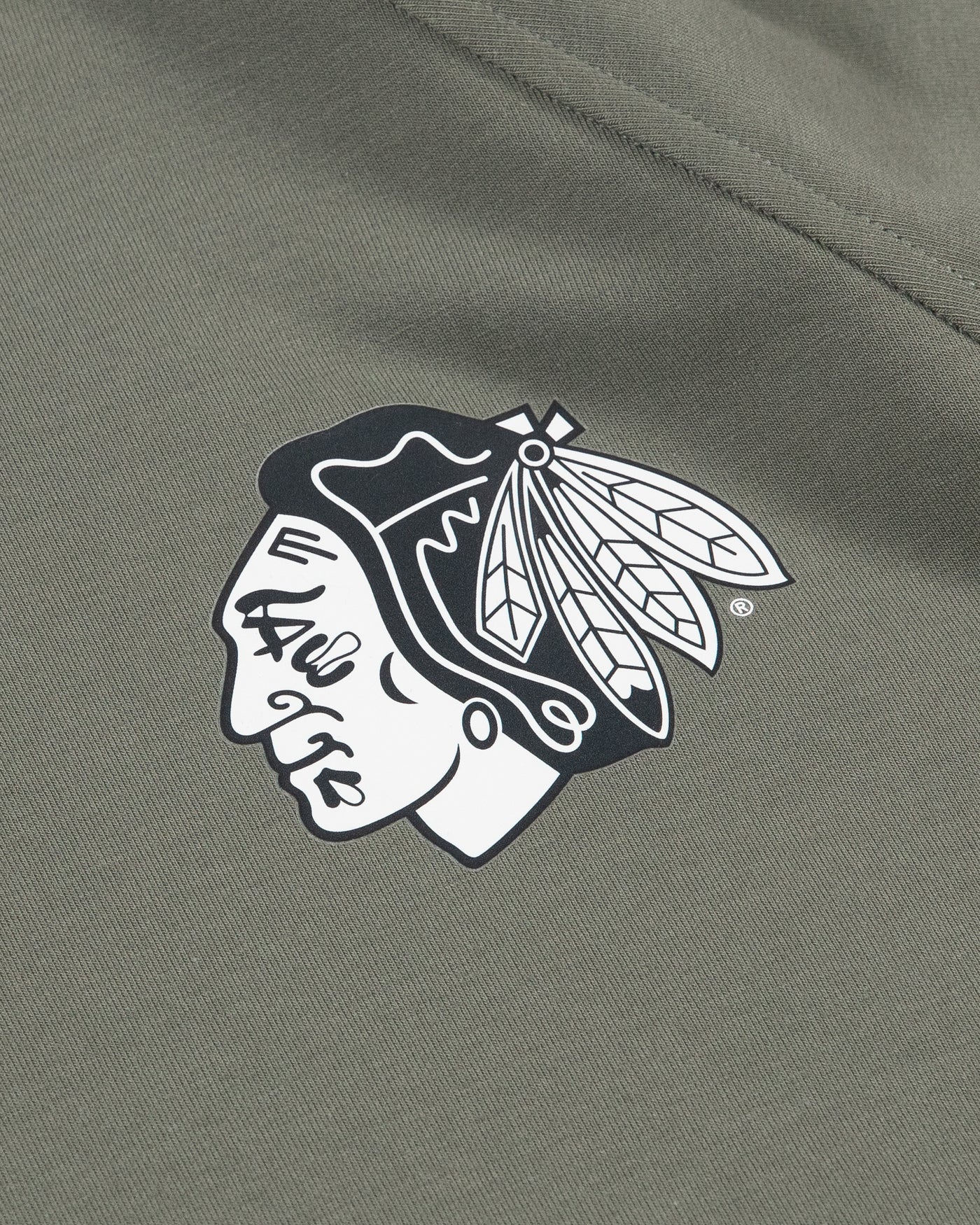 green lululemon hoodie with Chicago Blackhawks tonal primary logo on front left chest - detail lay flat