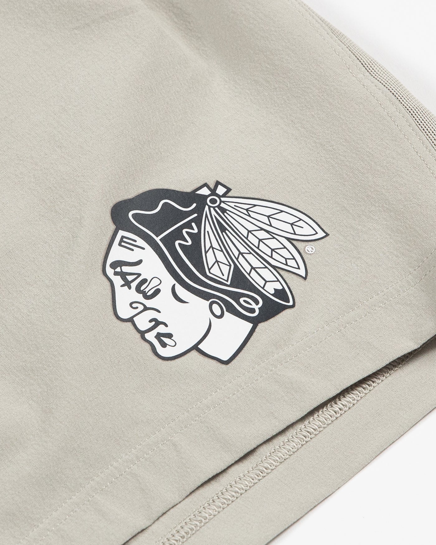 raw linen colored lululemon athletic shorts with tonal Chicago Blackhawks logo on left side - detail lay flat