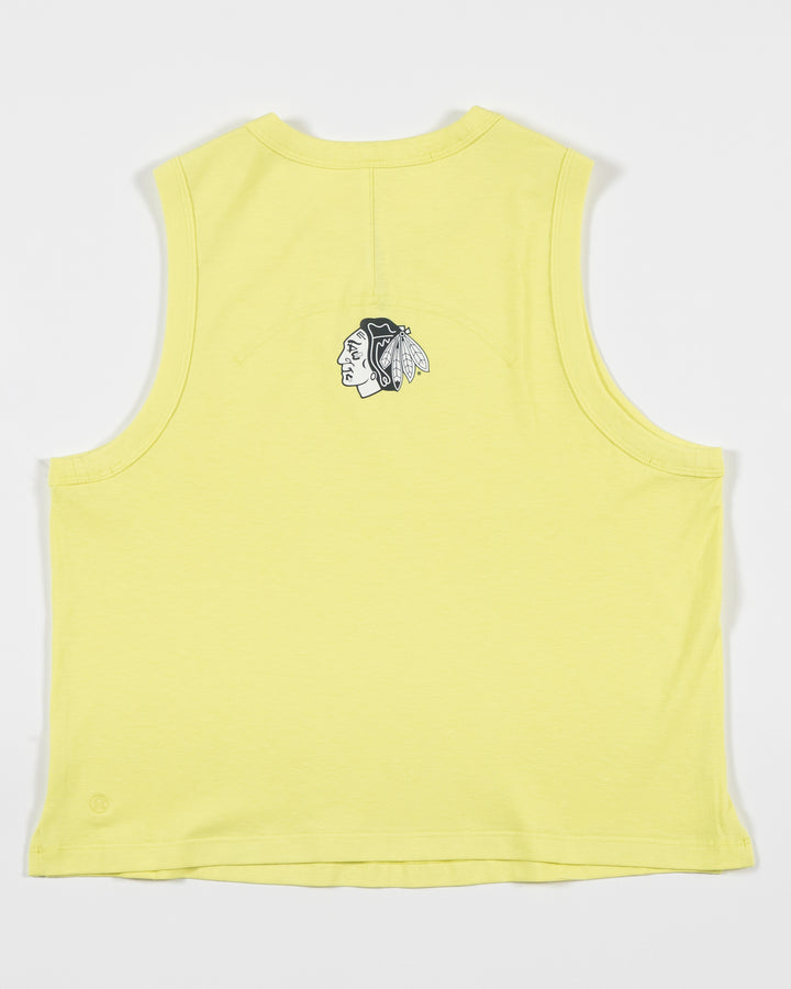 yellow lululemon tank top with Chicago Blackhawks logo on back - back lay flat