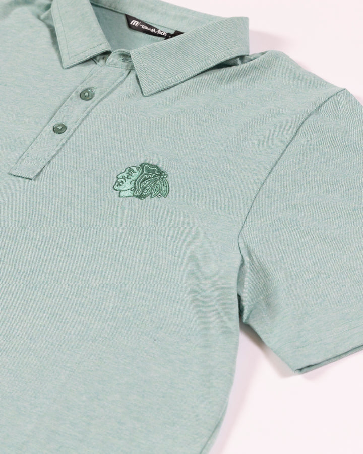 TravisMathew Chicago Blackhawks green polo with embroidered tonal primary logo - detail lay flat