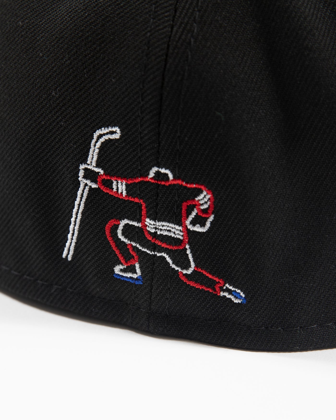 New Era black fitted hat with neon lights inspired primary logo - back detail view of embroidered celly decal