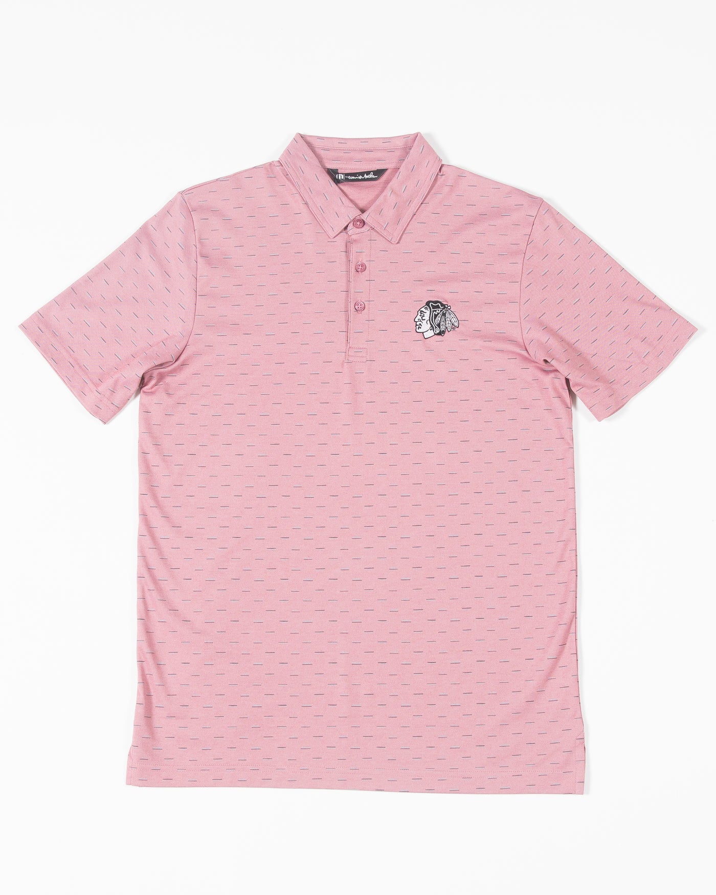 red geo print TravisMathew polo with embroidered tonal Chicago Blackhawks primary logo on left chest - front lay flat