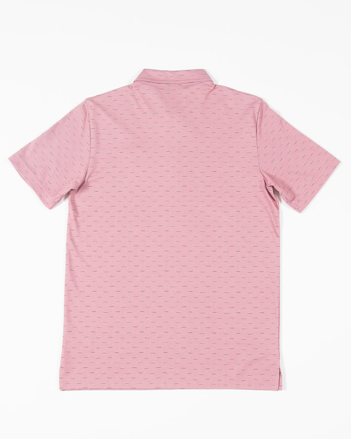 red geo print TravisMathew polo with embroidered tonal Chicago Blackhawks primary logo on left chest - back lay flat