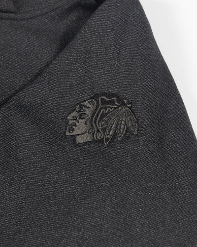 black cropped lululemon hoodie with tonal Chicago Blackhawks primary logo embroidered on left shoulder - detail lay flat