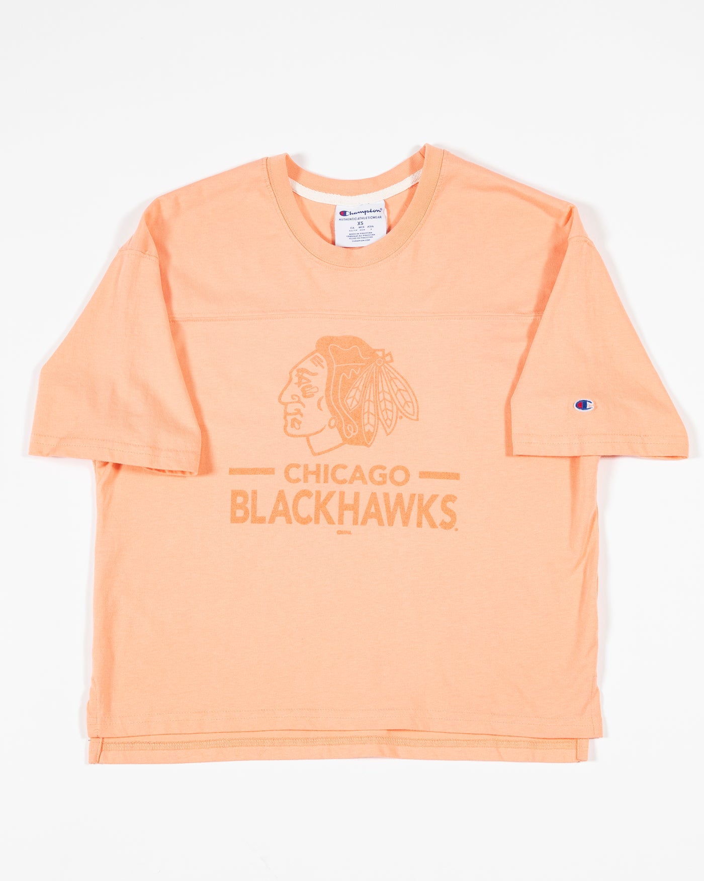 peach Champion cropped tee with Chicago Blackhawks primary logo and wordmark across the chest - front lay flat