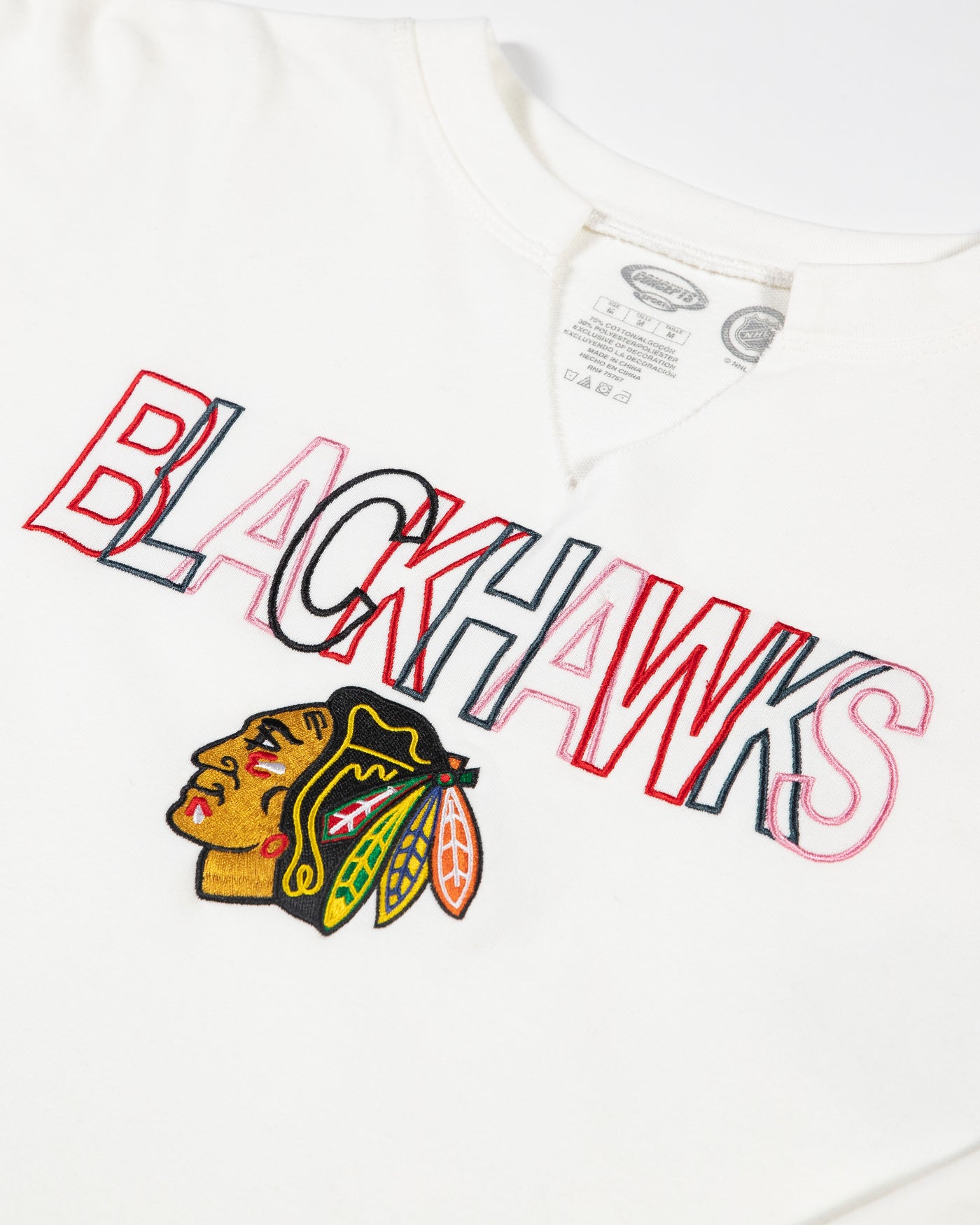 white Concept Sports split neckline sweatshirt with embroidered Chicago Blackhawks wordmark and primary logo - detail lay flat