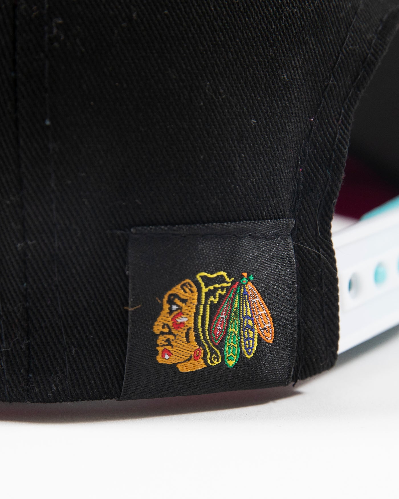 black Outerstuff youth neon snapback with Chicago Blackhawks primary logo on front - detail lay flat