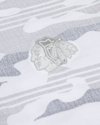 white camo TravisMathew polo with Chicago Blackhawks primary logo embroidered on left chest - detail lay flat