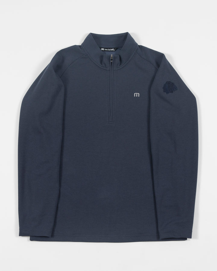 navy TravisMathew quarter zip with Chicago Blackhawks primary logo embroidered on left shoulder - front lay flat