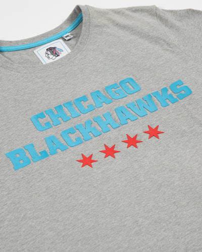 grey Sport Design Sweden short sleeve tee with raised Chicago Blackhawks word graphic above four Chicago stars - detail lay flat