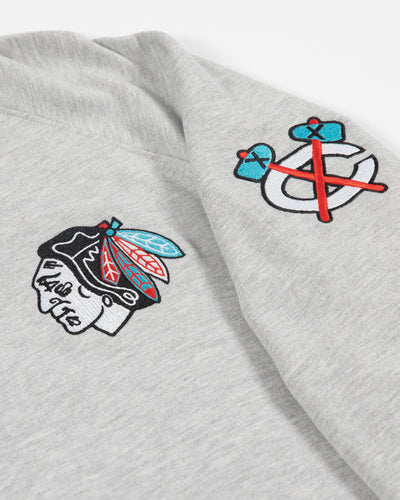 Sport Design Sweden grey crewneck with Chicago Blackhawks primary and secondary logos embroidered and black, grey and red ribbing on hem and cuffs - detail lay flat
