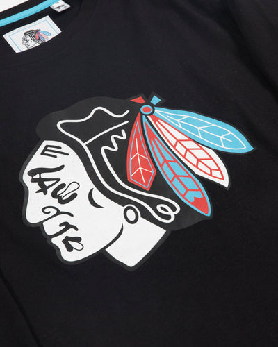 Sport Design Sweden black long sleeve tee with Chicago Blackhawks primary logo across chest and Chicago four stars along left arm - detail lay flat