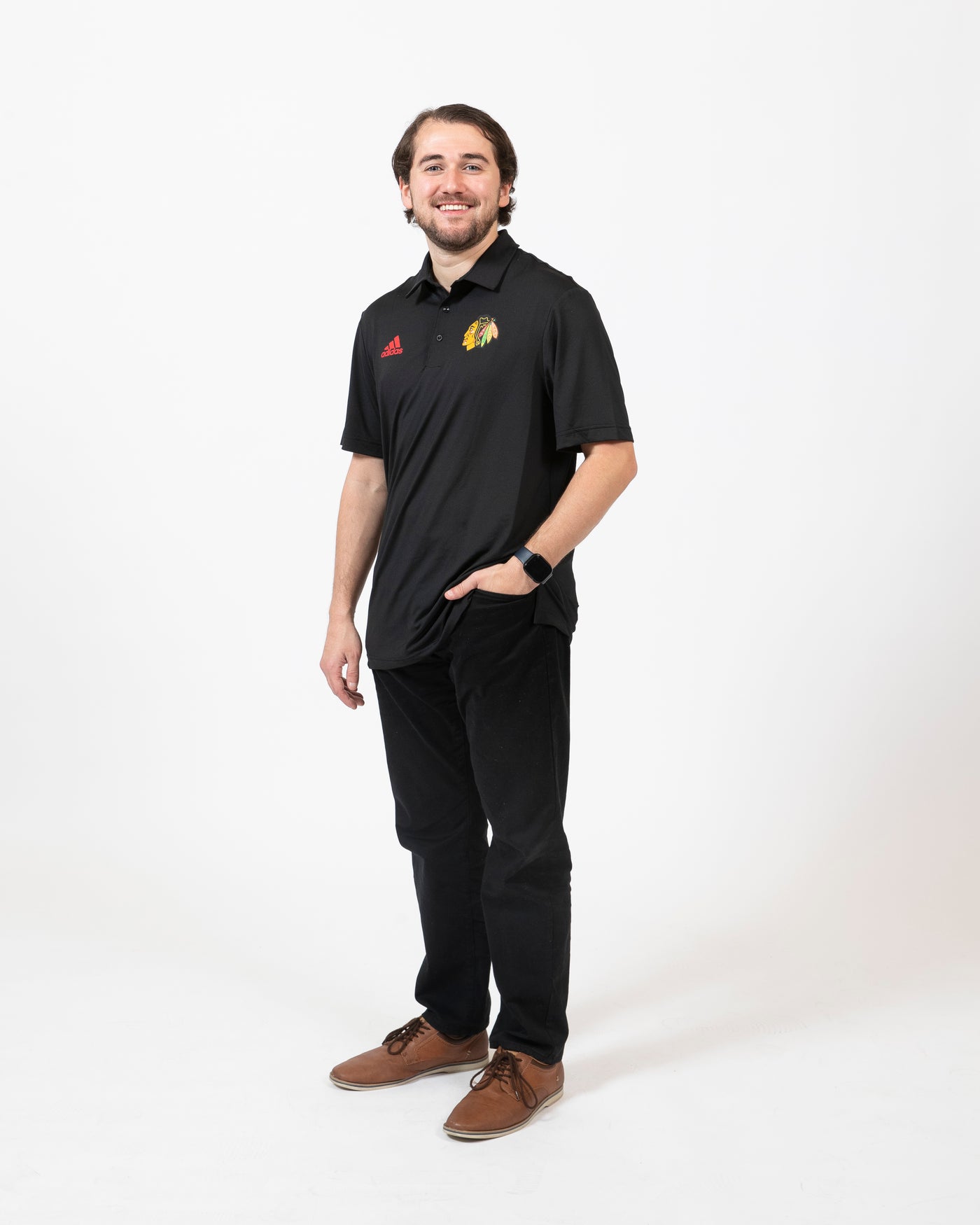Black adidas polo with embroidered primary logo on left chest and red embroidered adidas logo on right chest - side on model shot