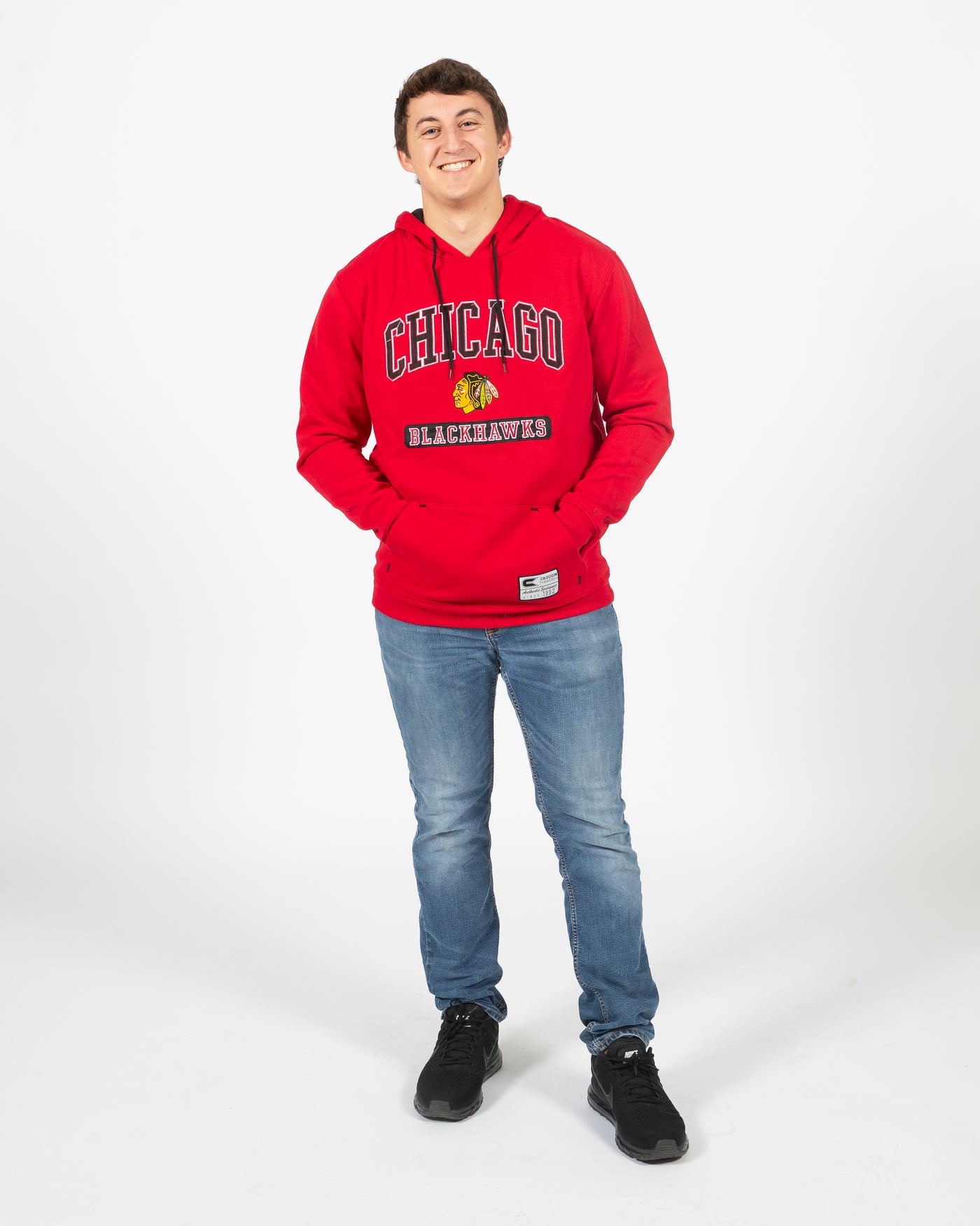 Colosseum red Chicago Blackhawks hoodie with primary logo and wordmark across chest - alt front view