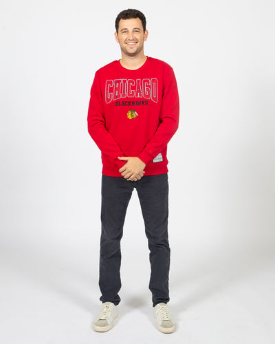 Colosseum red Chicago Blackhawks crewneck sweater with primary logo and wordmark across chest - alt front view