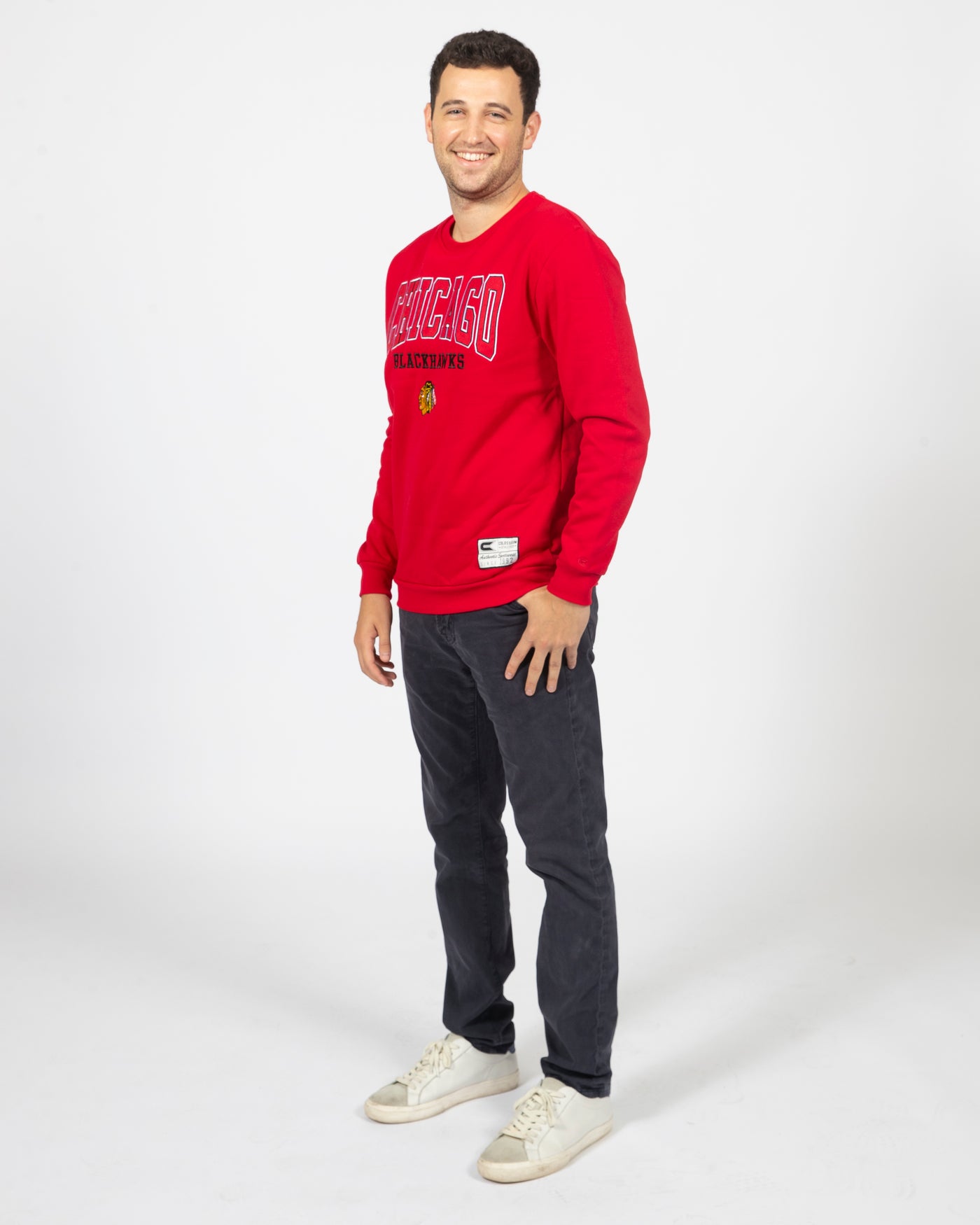 Colosseum red Chicago Blackhawks crewneck sweater with primary logo and wordmark across chest - side view