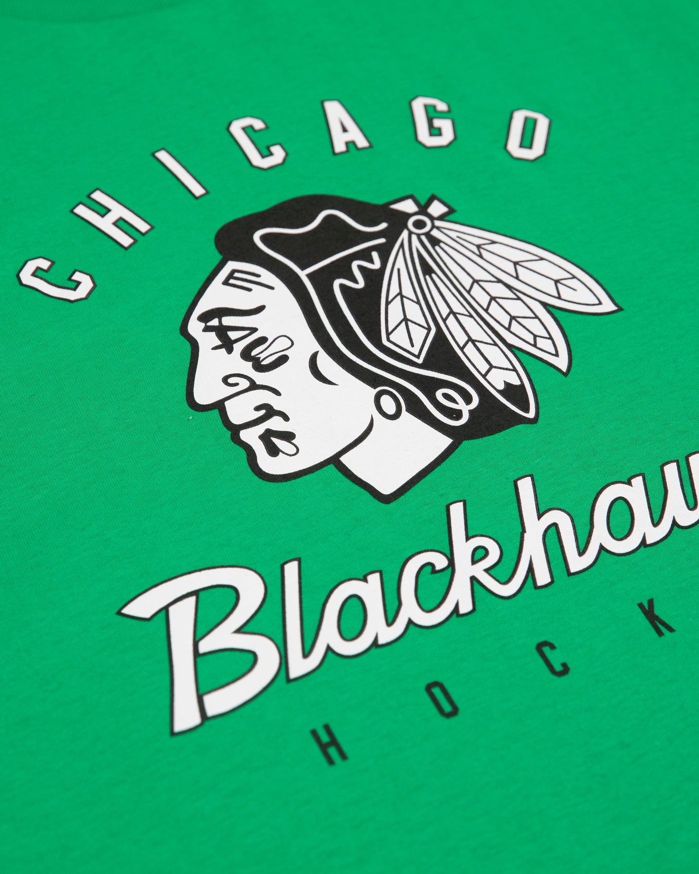 Green Chicago Blackhawks tee with black and white tonal primary logo and wordmark across chest - detail lay flat